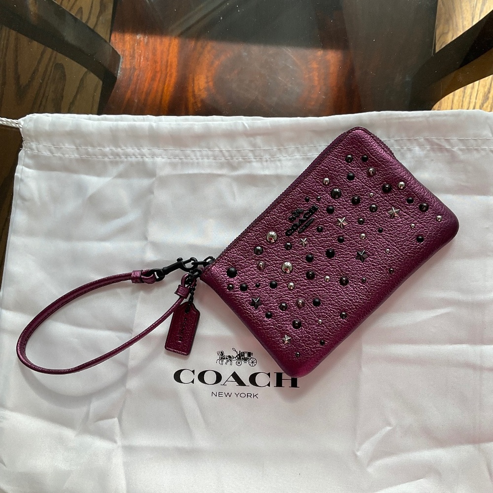 Coach metallic purple leather wristlet pouch with stars and studs- never used